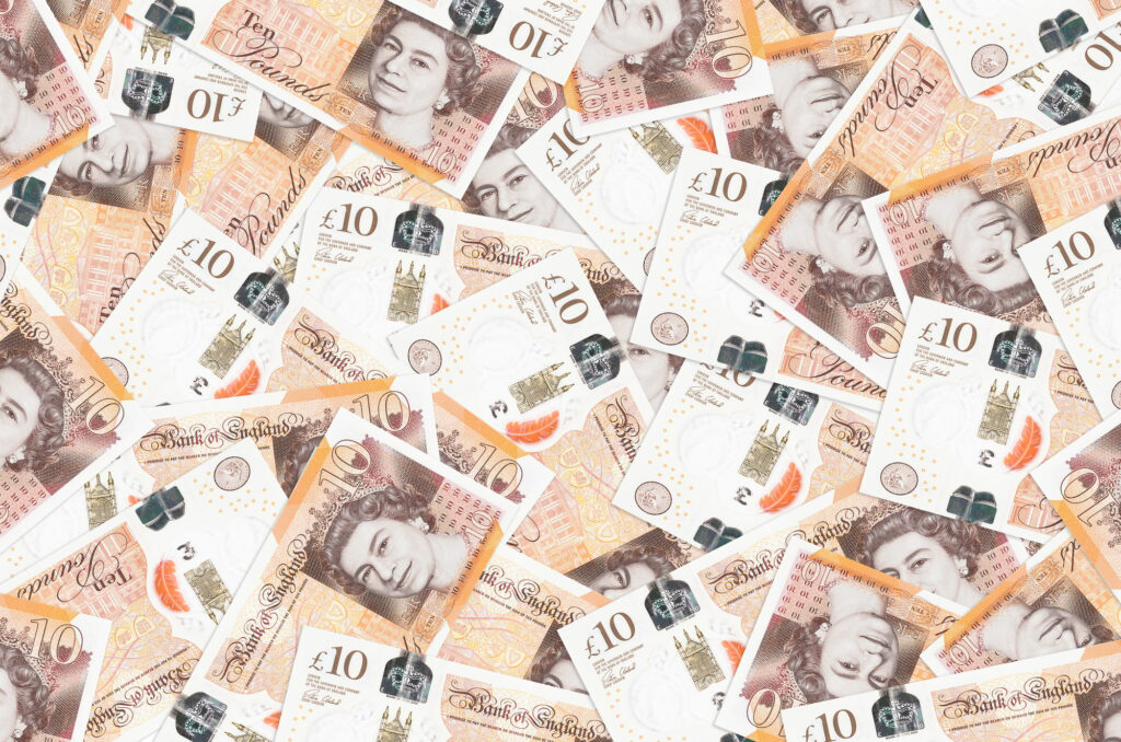 10 British Pounds Bills Lies In Big Pile Inside Of Rich Life Conceptual Background | EMAIL SPOT